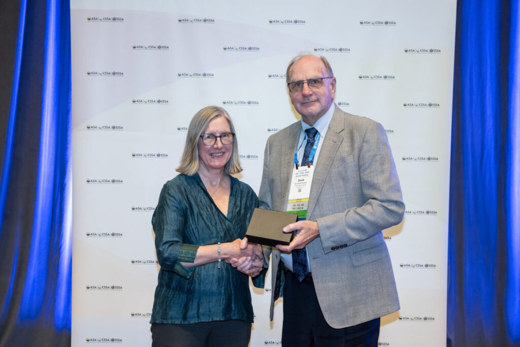 David Baltensperger receives an award from the Crop Science Society of America