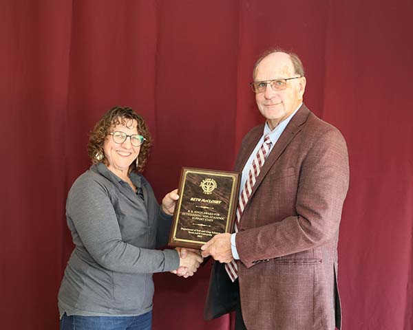 Beth McClosky standing with David Baltensperger, professor and department head.