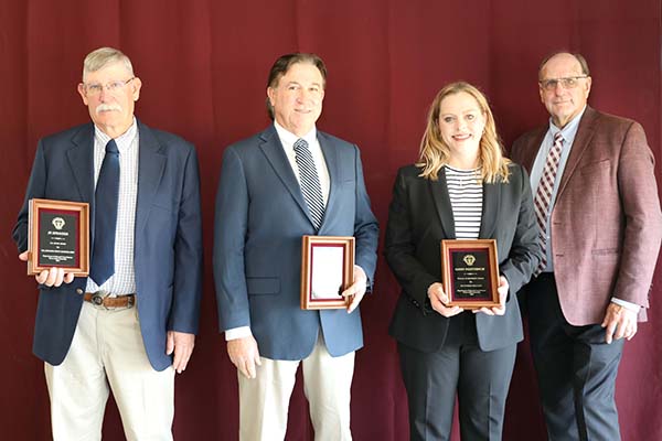 District 1 Team: J.R. Sprague,Scott Strawn and Kristy Slough standing with David Baltensperger, professor and department head.