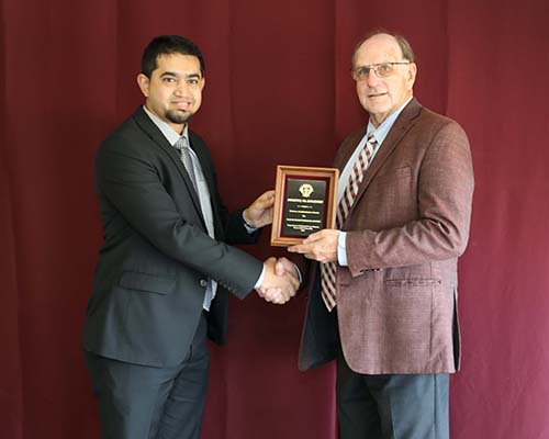 Sk. Musfiq-Us-Salehin standing with David Baltensperger, professor and department head.