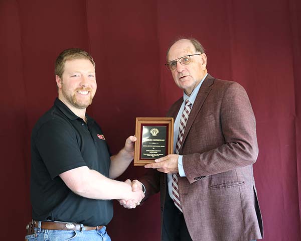 Todd Fisk standing with David Baltensperger, professor and department head.