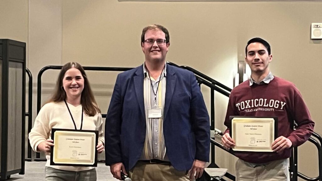 Kayla Beechinor, left, standing with Mason Marshall, center, and Isaac Juarez, right